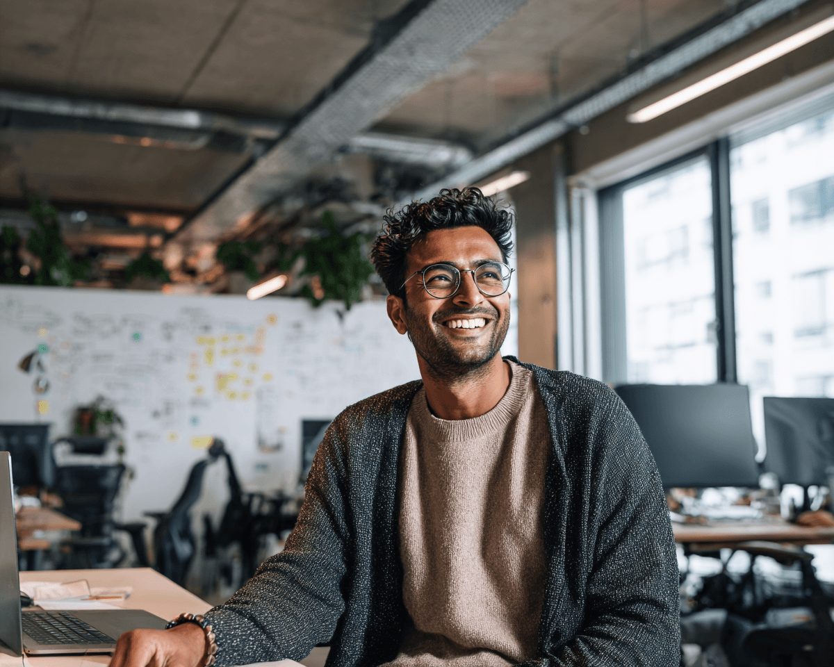 Man smiling in an office